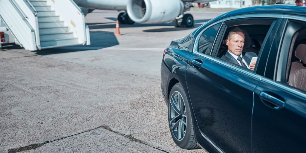 What questions should I ask before booking an airport taxi?
