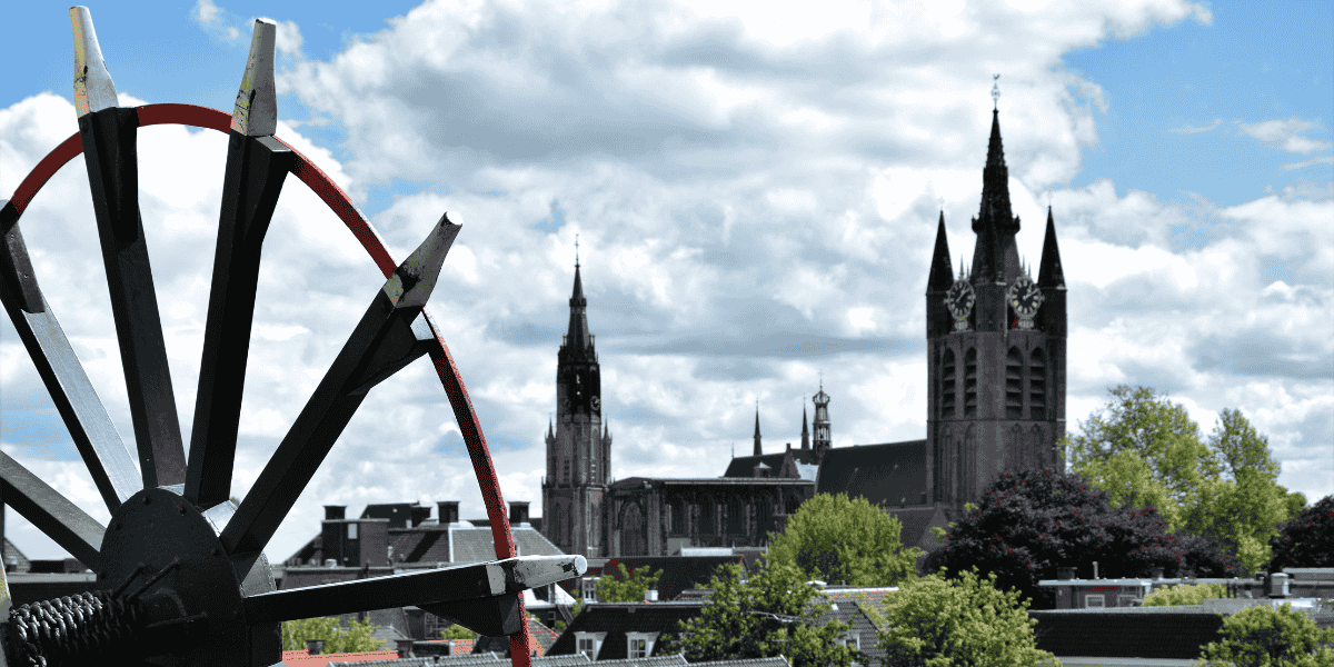 A large wheel characterized by a black surface and vibrant red details, emphasizing its bold design.